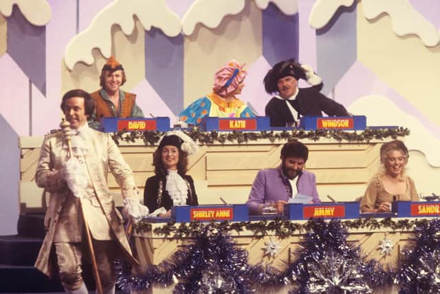 Windsor Davies (top right), who has died, appearing in pantomime costume on the Christmas edition of Blankety Blank with (left to right) host Terry Wogan, David Hamilton, Shirley Anne Field, Katie Boyle, Jimmy Tarbuck and Sandra Dickinson. Picture: PA Wire