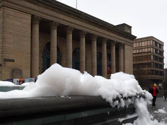The fountains outside the City Hall covered in foam. Picture: Andrew Roe.