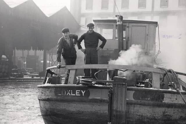 James Wallker and Brian Appleyard from Hull look over the stern of their barged at the ice-bound Canal Wharf, Sheffield during the big freeze of January 1963