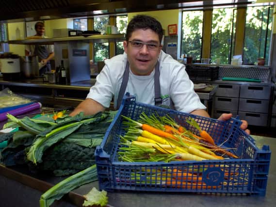 Former head chef Rupert Rowley with a range of fresh produce from the gardens at Fischer's