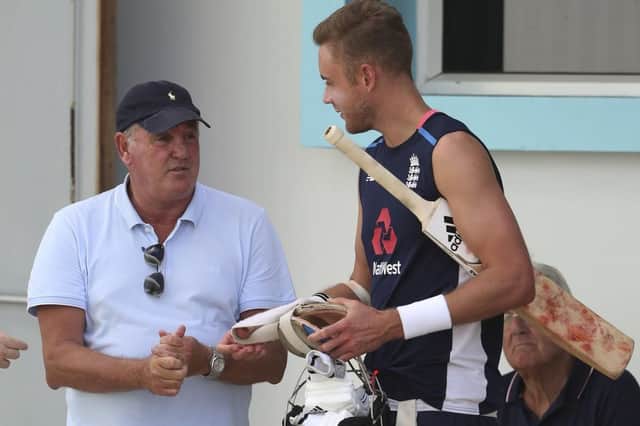 Steve Bruce, manager of Sheffield Wednesday soccer club, talks to Stuart Broad during a training session of England's cricket team at the Kensington Oval in Bridgetown, Barbados, (AP Photo/Ricardo Mazalan)