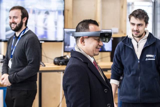 Minister of Education Malaysia, Dr Maszlee Malik has some fun testing the AMRC's digital capabilities at Factory 2050, home to the Integrated Manufacturing Group. Picture Tracey Welch