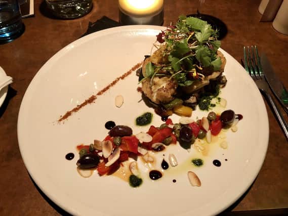 Napoleons food review - pictured is roasted cauliflower steak, seared red pepper, caper and olive salsa and toasted almonds.