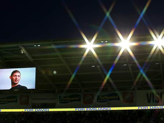 A picture of Emiliano Sala is shown on the big screen in tribute to the missing footballer at Cardiff City Stadium during the Premier League match at the Cardiff City Stadium. Mark Kerton/PA Wire.