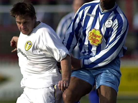 John Hendrie in action for the Leeds United Legends against Cyrille Regis of the Sheffield Wednesday Legends at the Jane Tomlinson charity match held at Belle Vue, Wakefield in March 2003