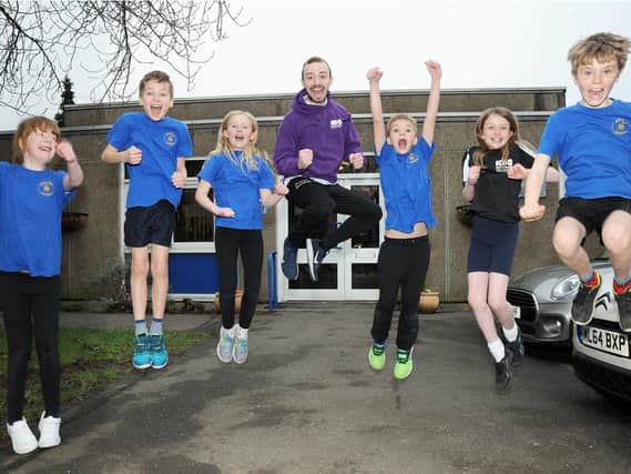 Ryan Smith, a teacher at Stonelow Junior School, has won a BBC video competition urging kids to be active, which looks to be working with some of the children from the Dronfield school. Picture by Anne Shelley.