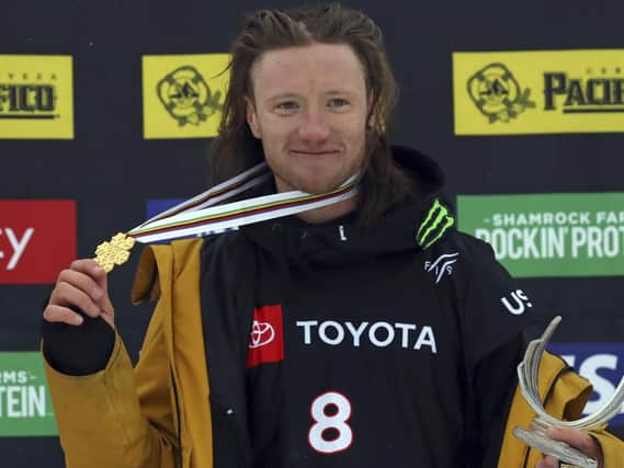 First place finisher James Woods celebrate on the podium following the men's slopestyle skiing world championship Wednesday, Feb. 6, 2019, in Park City, Utah. (AP Photo/Rick Bowmer)