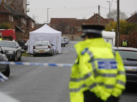 Police are looking to pay people to guard crime scenes (file photo)