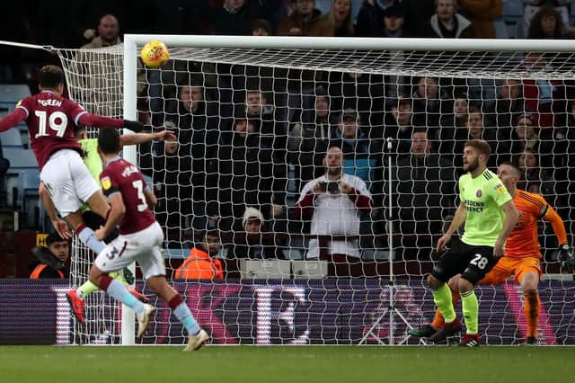 Aston Villa's Andre Green (left) scoring his side's third goal of the game during the Sky Bet Championship match at Villa Park, Birmingham. Nick Potts/PA Wire.