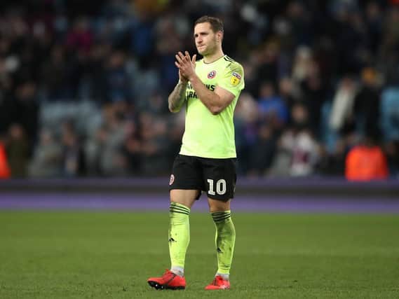Hat trick hero Billy Sharp cannot hide his disappointment after the Blades are pegged back late at Aston Villa
