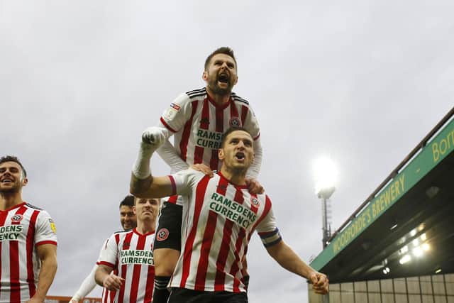 Billy Sharp celebrates a goal with Oliver Norwood: Simon Bellis/Sportimage