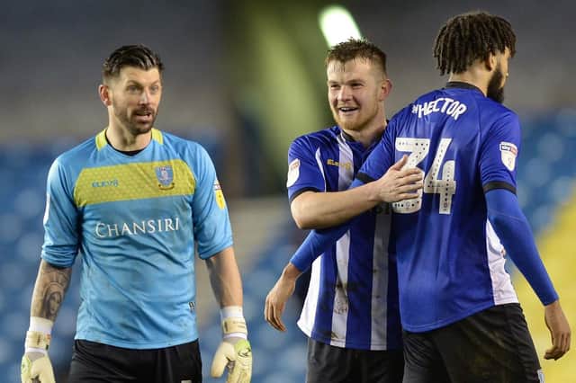 Another clean sheet for Owls keeper Keiren Westwood pictured with Jordan Thorniley and Michael Hector at the final whistle. Pic Steve Ellis.