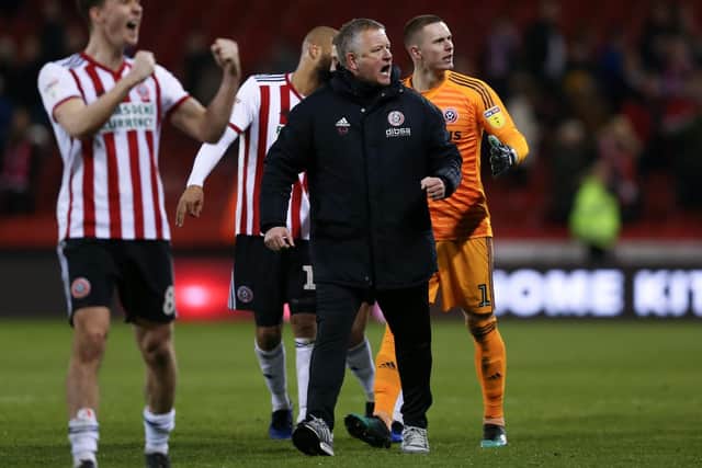 Chris Wilder celebrates with his players: James Wilson/Sportimage