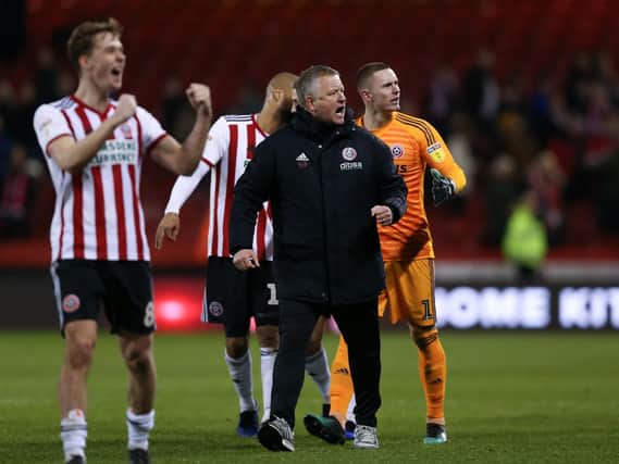 Chris Wilder celebrates with his players: James Wilson/Sportimage