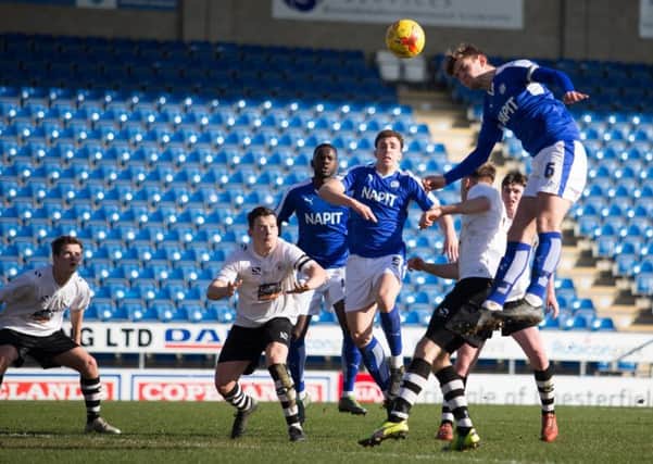 Chesterfield Reserves vs Gateshead Reserves - Laurence Maguire goes for a header - Pic By James Williamson
