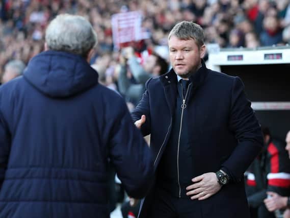 Grant McCann shakes hands with Crystal Palace manager Roy Hodgson