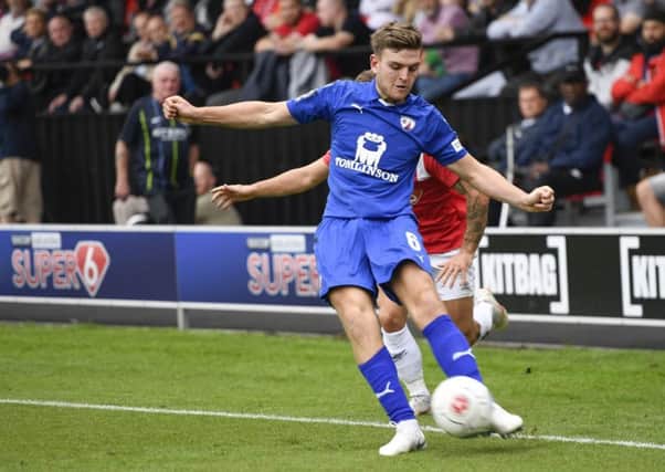 Chesterfieldâ¬"s Laurence Maguire crosses the ball: Picture by Steve Flynn/AHPIX.com, Football: Vanarama National League match Salford City -V- Chesterfield at Peninsula Stadium, Salford, Greater Manchester, England copyright picture Howard Roe 07973 739229