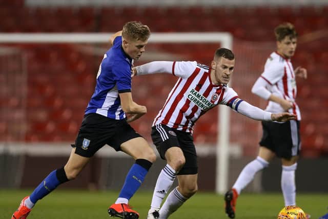 Jack Lee of Sheffield Wednesday tackles Paul Coutts of Sheffield Utd during the Professional Development League North match at Bramall Lane Stadium, Sheffield. James Wilson/Sportimage