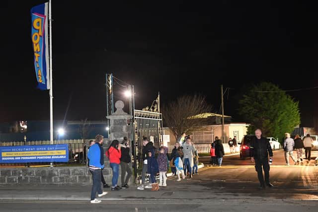 People stand at the entrance to Pontin's Brean Sands holiday park in Somerset. A "number" of people have been injured after a roof collapsed at the park, Avon and Somerset Police said. Ben Birchall/PA Wire