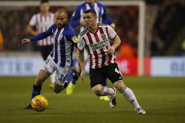 John Fleck of Sheffield United  chased by Barry Bannan of Sheffield Wednesday during the Sky Bet Championship match at Bramall Lane Stadium, Sheffield.  Simon Bellis/Sportimage