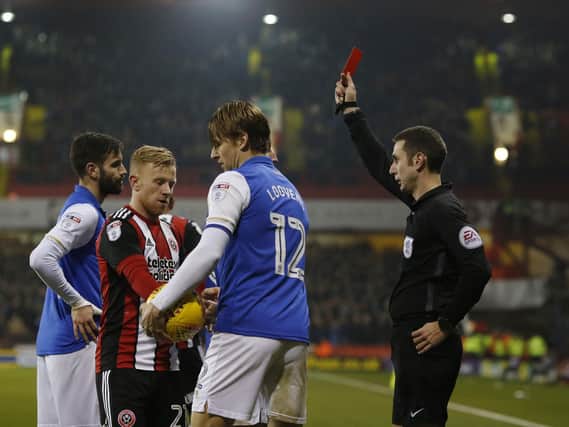 Glenn Loovens of Sheffield Wednesday receives a red card against Sheffield United last season: Andrew Yates/Sportimage