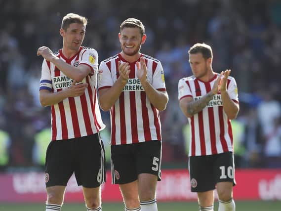 Chris Basham, Jack O'Connell (centre) and Billy Sharp celebrate a Sheffield United win