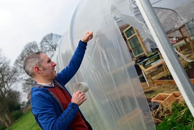 Volunteer James Starky, pictured helping to repair the Polytunnel. Picture: Marie Caley