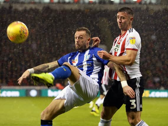 Steven Fletcher and Enda Stevens tussle in the last clash between Wednesday and United