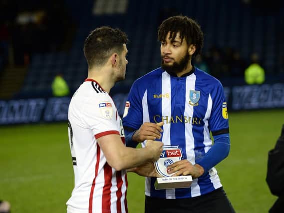Sheffield United's John Egan hands over Sky Man of the Match award to Michael Hector