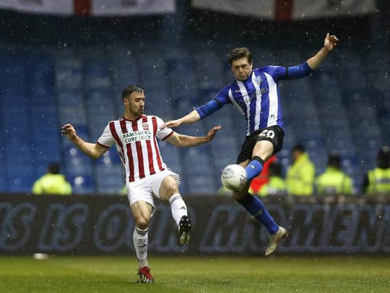Enda Stevans of Sheffield United and Adam Reach of Sheffield Wednesday battle for the ball. Photo: James Wilson/Sportimage