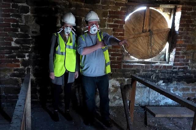 Building Better Parks: Darren Whittaker and Eleanor Wood from Sheffield's Parks Dept looking around the interior of the old Hillsborough Park coach house. Photo by David Bocking.