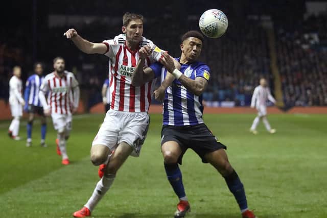 Sheffield United's Chris Basham (left) and Sheffield Wednesday's Liam Palmer battle for the ball: Simon Cooper/PA Wire.