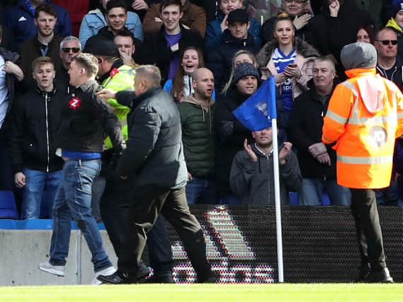 Paul Mitchell (left, on pitch, blue jeans) being escorted from the pitch after attacking Aston Villa's Jack Grealish during the Sky Bet Championship match at St Andrew's Trillion Trophy Stadium, Birmingham. Picture: Nick Potts/PA Wire