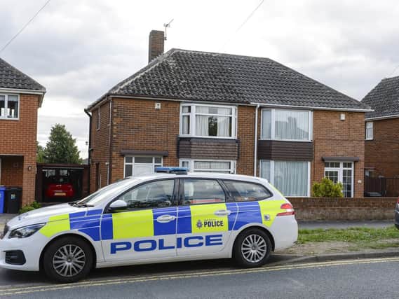 Police officers and scenes of crime officers at a property in Orgreave Lane Sheffield, where Allan Grayson, 85, was fatally stabbed