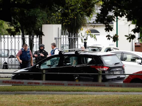 Police officers are seen at the Masjid al Noor mosque after a shooting incident in Christchurch on March 15, 2019 (Photo TESSA BURROWS/AFP/Getty Images).
