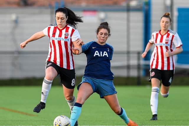 Sophie Jones of Sheffield Utd is tackled by Coral-Jade Haines of Tottenham during the FA Women's Championship game at the Olympic Legacy Park, Sheffield. Photograph by Harry Marshall/Sportimage