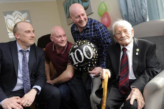 Pictured is Roy with three grandchildren Ross, Gary and Paul