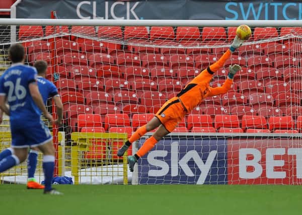 Picture by Gareth Williams/AHPIX.com; Football; Sky Bet League Two; Swindon Town v Chesterfield FC; 11/11/2017 KO 15.00; The Energy Check County Ground; copyright picture; Howard Roe/AHPIX.com; Joe Anyon gets fingers to an early effort from Swindon's Johnny Goddard