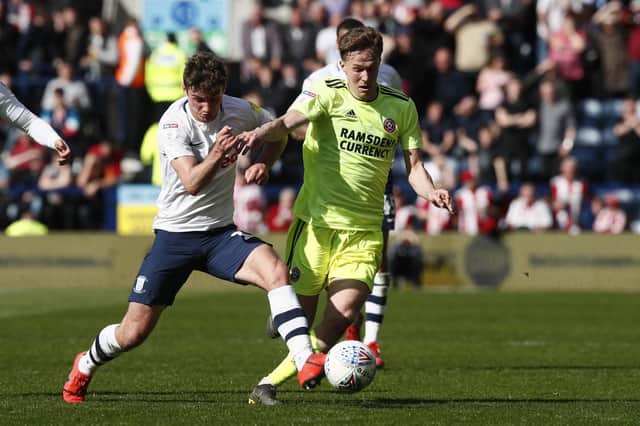 Kieran Dowell of Sheffield Utd tackled by Ryan Ledson - Simon Bellis/Sportimage
