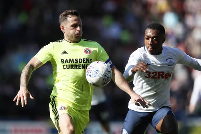 Billy Sharp of Sheffield Utd and Darnell Fisher of Preston North End - Simon Bellis/Sportimage