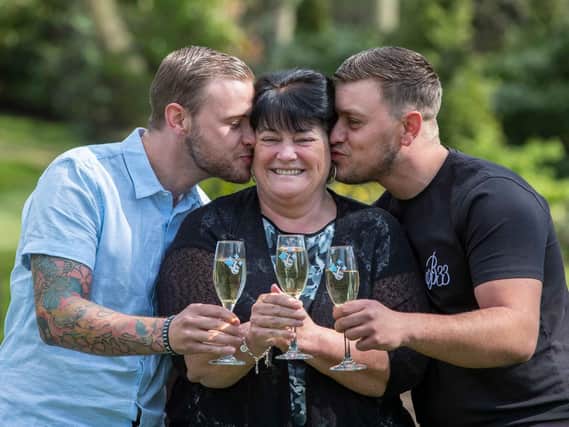 Winner Paula Williamson, centre, with her two sons, Jack (left) and Ian at Wentbridge House Hotel, Wentbridge, Pontefract. Picture: 
Jason Roberts/National Lottery/PA Wire