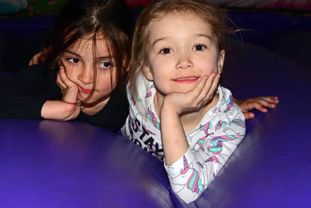 Asia Hizam, six and Olivia Thomas, six, pictured. Picture: NSST-08-04-19-BounceHouse-2