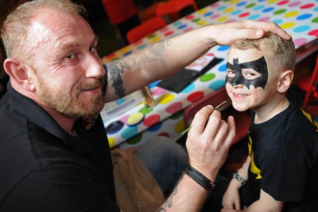 Bounce House owner Andy Cleminson, pictured painting the face of Adam Webster, five, during the fundraising event. Picture: NSST-08-04-19-BounceHouse-3