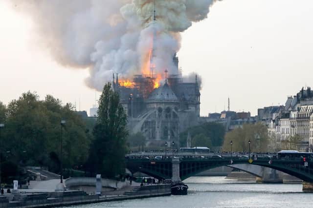 Smokes ascends as flames rise during a fire at the landmark Notre-Dame Cathedral in central Paris on April 15, 2019 afternoon, potentially involving renovation works being carried out at the site, the fire service said. (Photo by FRANCOIS GUILLOT / AFP)        (Photo credit should read FRANCOIS GUILLOT/AFP/Getty Images)