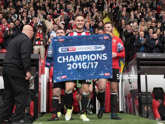 SHEFFIELD, ENGLAND- APRIL 17: Billy Sharp of Sheffield United celebrates winning promotion to the Sky Bet Championship after the Sky Bet League One match between Sheffield United and Bradford City at Bramall Lane on April 17, 2017 in Sheffield, England. (Photo by Nathan Stirk/Getty Images)