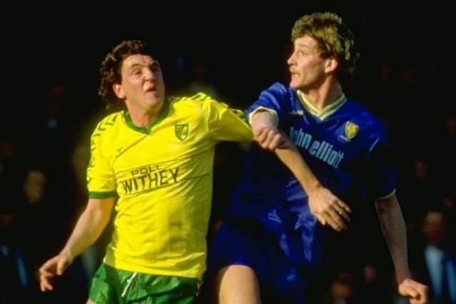 Steve Bruce (left) of Norwich City in action during a Canon League Division Two match against Wimbledon at Plough Lane in London. Credit: Allsport UK /Allsport