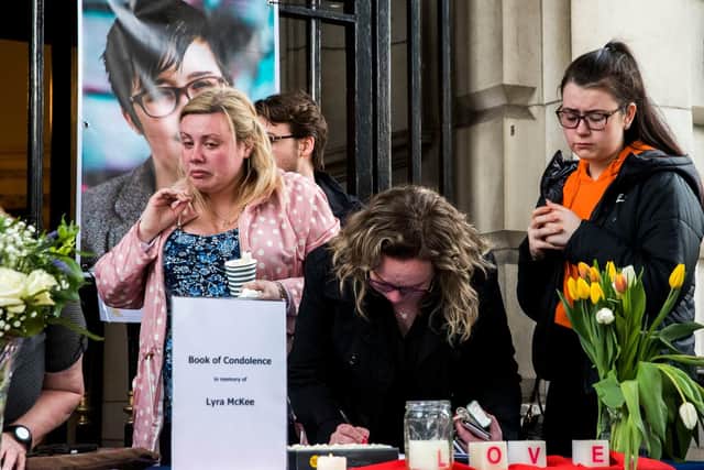 People signing a book of condolence after a vigil at Belfast City Hall in memory of murdered journalist Lyra McKee (pic:  Liam McBurney/PA Wire)