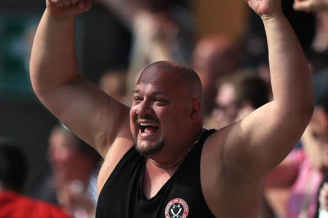 Sheffield United fan Tony Hill celebrates after his sides score their third goal during the Sky Bet Championship match at The KCOM Stadium, Hull. Pic: Mike Egerton/PA Wire.
