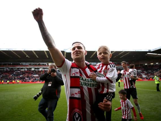 Sheffield born and bred: Billy Sharp celebrates United all but clinching promotion to the Premier League with a win 2-0 over Ipswich