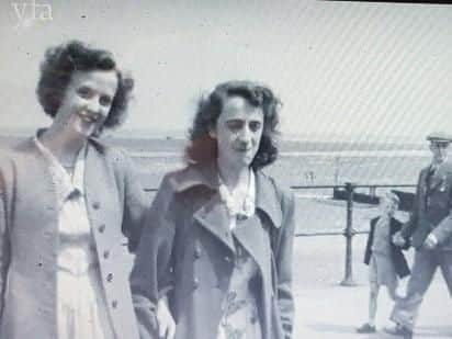 Seaside outing, but who are these women?